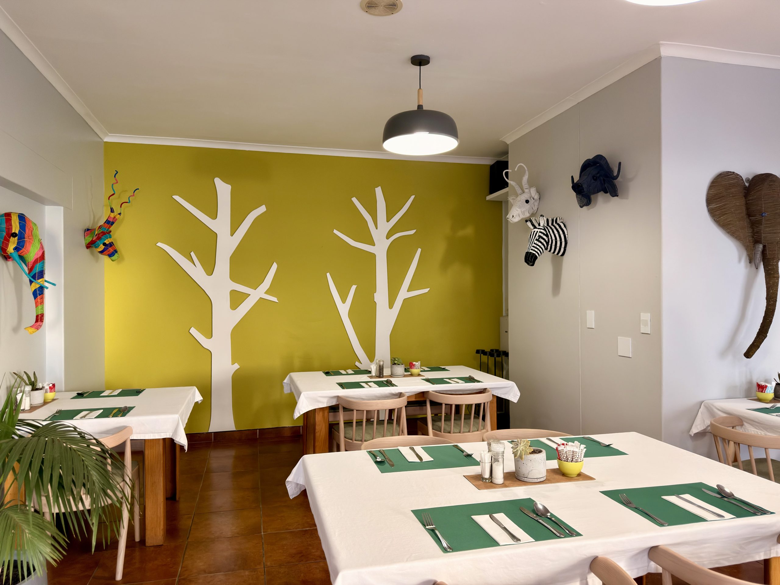 Dining room with feature tree wall at The Langholm Hotel