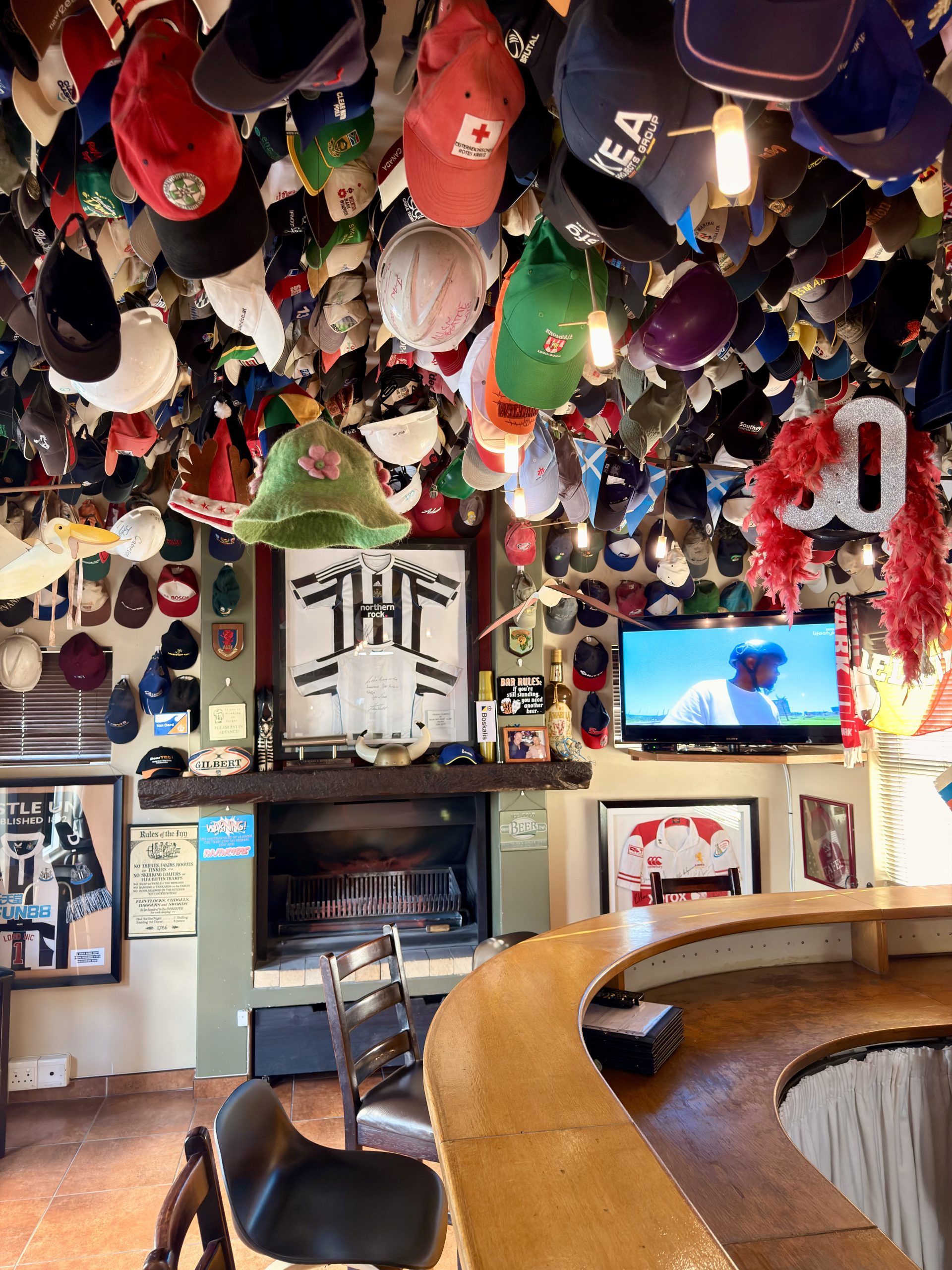 The NightCap Bar with its cap collection at The Langholm Hotel