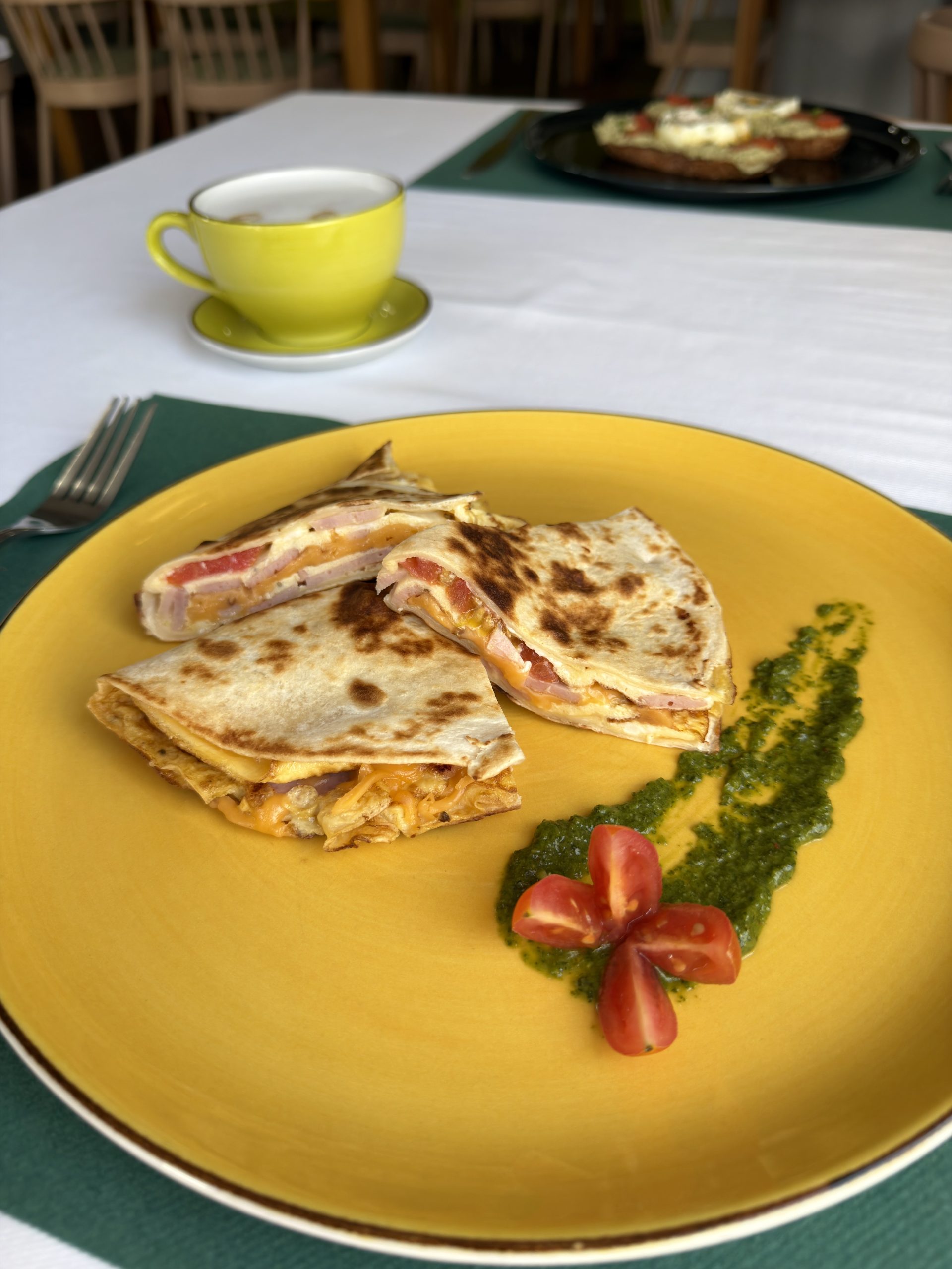 Plated dish on a yellow plate at Dinner@langholm, Walvis Bay